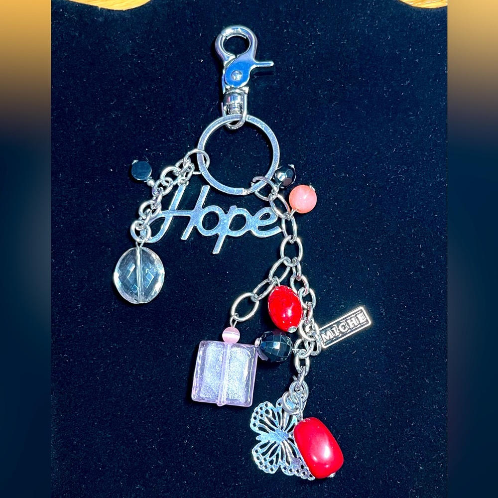 Miche red, pink, and silver HOPE keychain. Approximately 6 inches long.